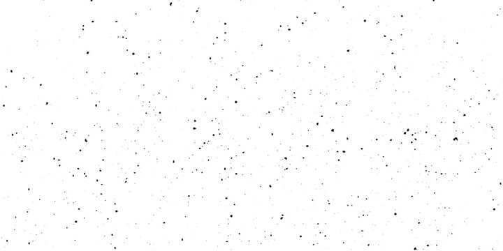 An abstract pattern of small, dark speckles scattered across a bright white canvas, creating a minimalist and textured background.