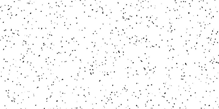 A background composed of numerous small black dots scattered across a white surface, creating a textured, abstract pattern.