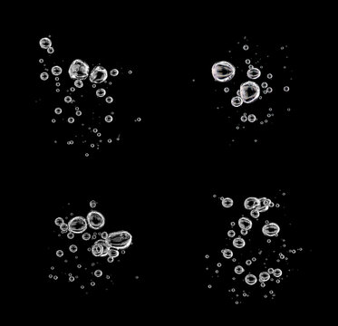 set bubbles rising to the water's surface isolated on a black background. drop air in water flowing up, underwater, clear liquid. water bubble white oxygen air