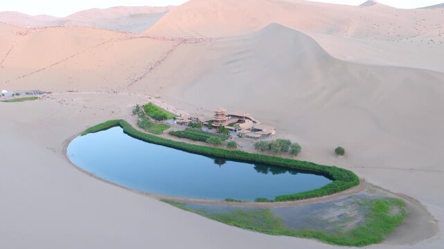 erial Drone Footage of Crescent Moon Spring, Mingsha Mountain Desert Oasis at Sunset, Dunhuang Gansu China
Panoramic Wide Shot of Dunhuang Crescent Lake Surrounded by Giant Sand Dunes, Ancient Chinese