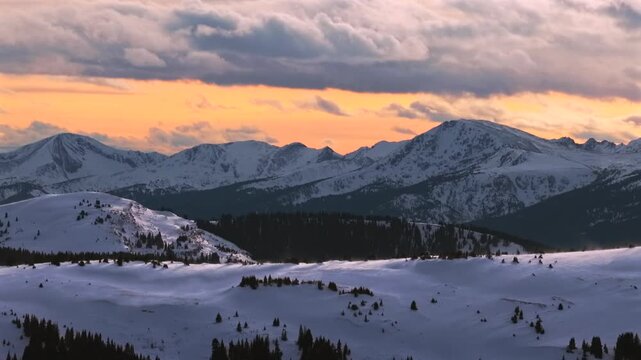 Winter Sunset Vail Pass Mount of the Holy Cross aerial drone Sawatch Range Colorado Rockies 14er backcountry White River National Forest snow-covered peak nature landmark landscape circle right motion