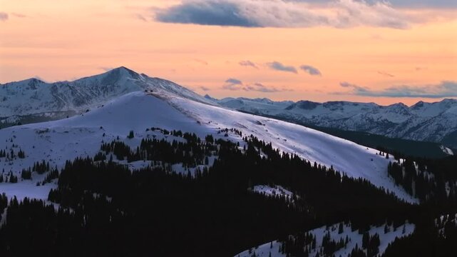 Winter Vail Pass Ptarmigan Hill Shelter sunset aerial drone Colorado Rockies backcountry Avalanche bowl ski snowmobile glades snow-covered rugged peaks nature landmark landscape circle left