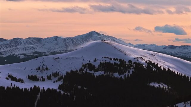 Winter sunset Vail Pass aerial drone Colorado Rockies Ptarmigan Hill shelter backcountry ski snowmobile glades snow-covered rugged peaks nature landscape White River National Forest cloudy windy