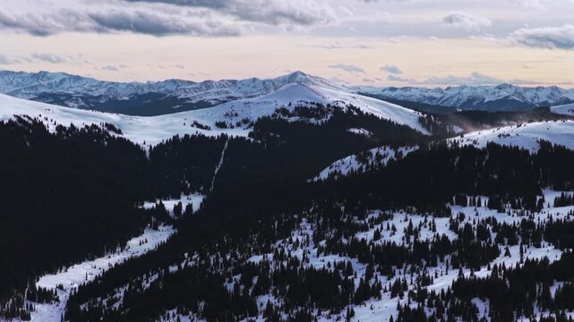 Winter Vail Pass recreation backcountry ski snowmobile trail aerial drone Colorado Rockies Ptarmigan Hill glades snow-covered rugged peaks sunset nature landscape White River National Forest upwards