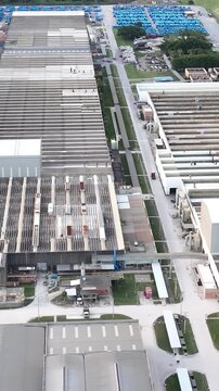 Industrial Data center in Santa Catarina, Brazil. Aerial view in vertical video. Production of porcelain tiles and large format porcelain slabs.