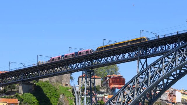 Metro train crossing the Dom Luis I bridge in Porto, Portugal
