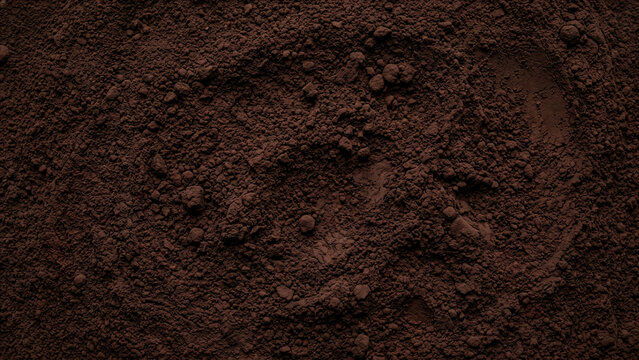 Macro Close-Up Top View of Dark Cocoa Powder with Granule and Lumpy Texture Filling Full Frame &mdash; Premium Chocolate Baking Ingredient and Food Background Photography