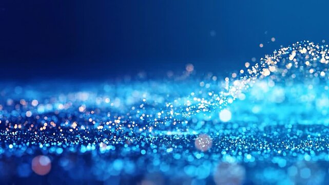 Abstract Blue Glitter Waves Shimmering blue and white particles create a mesmerizing wave like pattern suggesting digital motion data flow or cosmic energy