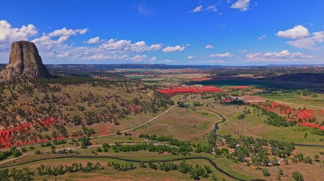 Panoramic aerial view of Devils Tower National Monument rising above the surrounding landscape in Wyoming