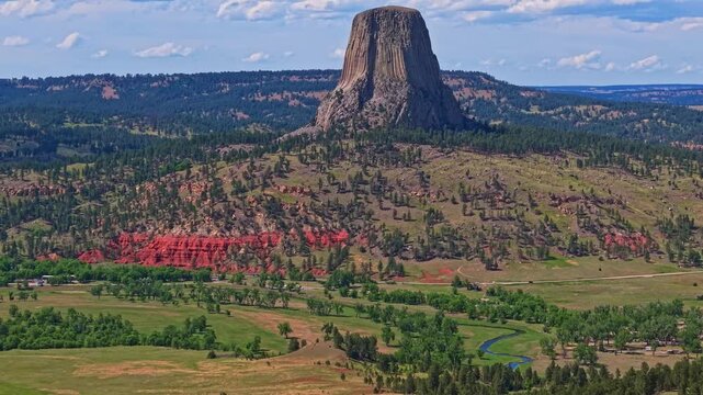 Close up aerial view of Devils Tower National Monument under clear skies in Wyoming