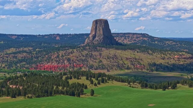 Close up aerial view of Devils Tower National Monument under clear skies in Wyoming