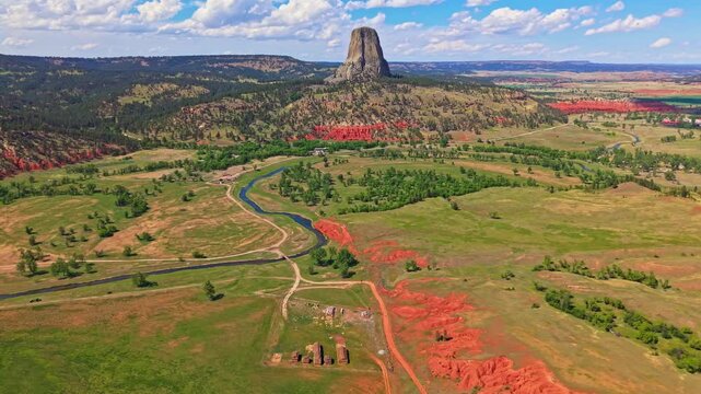 Panoramic aerial view of Devils Tower National Monument rising above the surrounding landscape in Wyoming