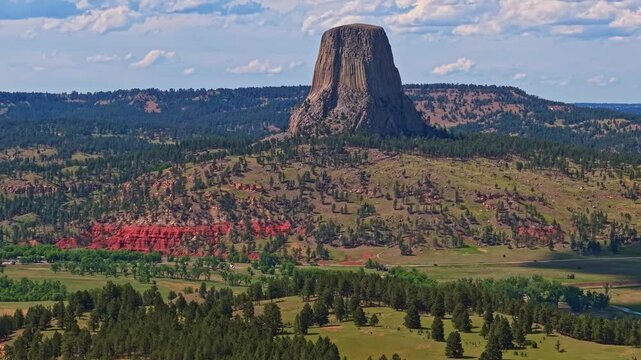 Close up aerial view of Devils Tower National Monument under clear skies in Wyoming