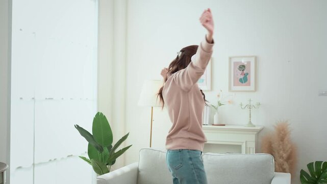 Enjoying Music While Relaxing in a Bright Living Room