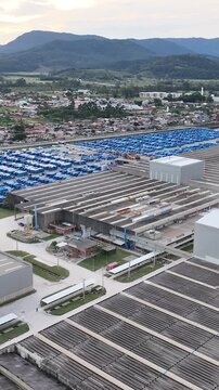 Industrial Data center in Santa Catarina, Brazil. Aerial view in vertical video. Production of porcelain tiles and large format porcelain slabs.