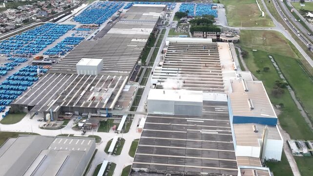 Industrial Data center in Santa Catarina, Brazil. Aerial view in vertical video. Production of porcelain tiles and large format porcelain slabs.