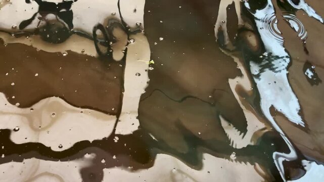 Abstract reflective patterns shimmering across undulating water surface, creating dynamic textures, ripples and fluid natural motion in an artistic background