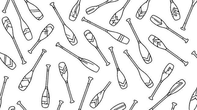 Collection of various wooden canoe paddles arranged in pattern.