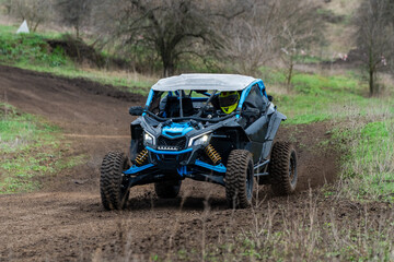 Can-am maverick utv racing off-road on dirt track © Antonio