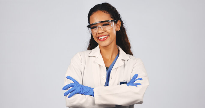 Scientist, portrait of woman in studio with crossed arms, lab coat and ppe for medical research. Space, healthcare and person with protection, goggles and safety gear for science on white background