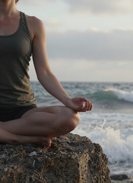 Captures Person In Midst Of Practicing Yoga On Beach To Sunrise Sunset Individual Seated Cross Legged With Left Leg Bent Inward Towards Body