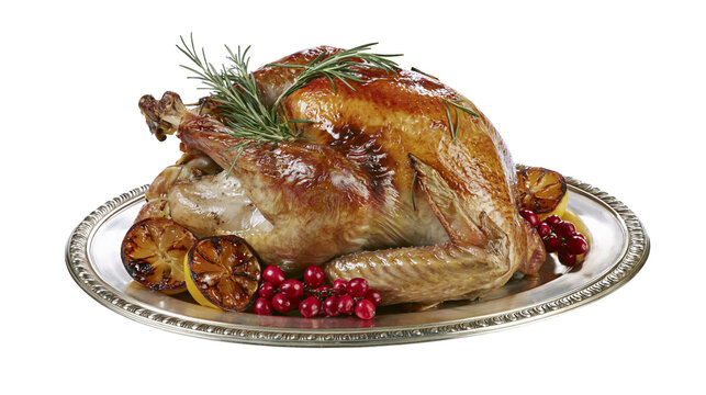 Golden roasted turkey with rosemary cranberries and lemon slices, isolated on transparent background