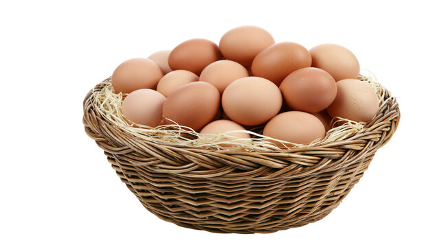 Wicker basket overflowing with brown eggs and straw, isolated on transparent background