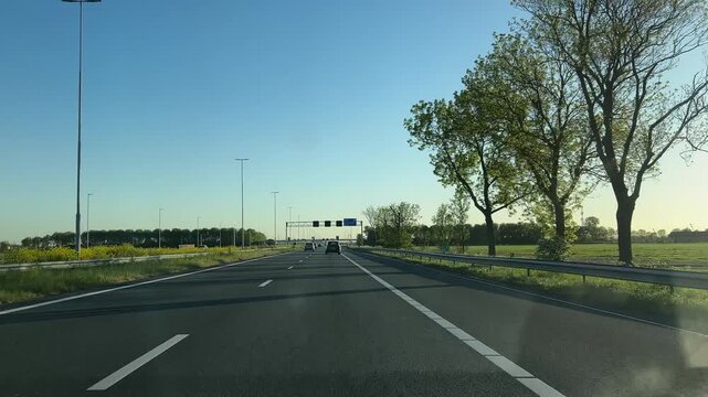 Amsterdam Netherlands highway, Cars Driving on a Modern Highway at Sunrise