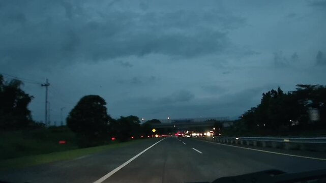 Driving on Toll Road Under Cloudy Sky in East Java Indonesia