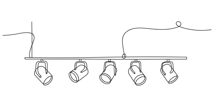Five adjustable track lighting spotlights hanging from a metal ceiling rail