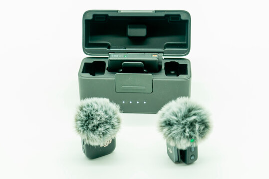 A DJI mini microphone box with a logo isolated on a white background, in Minsk, Belarus, May 5, 2026. Wireless microphone set with windshields and charging case for clear audio recording