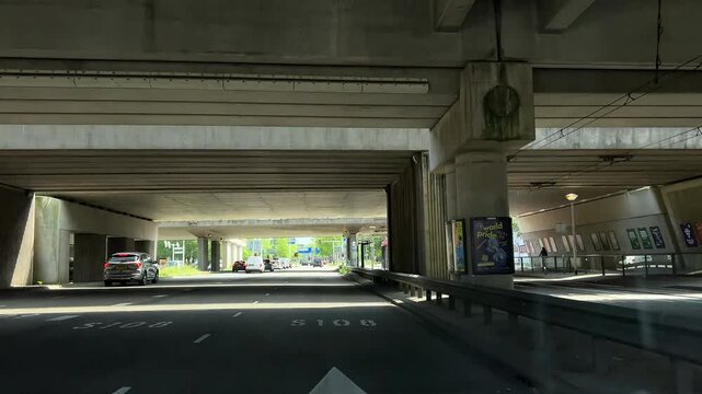Amsterdam suburbs, Amstelveen, Suburban road under elevated highway in Dutch suburb