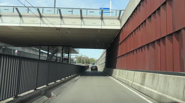 Suburban Dutch underpass scene with concrete walls