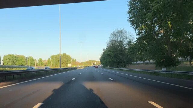 Amsterdam Netherlands highway, Forward view of a highway approaching an overpass in warm daylight
