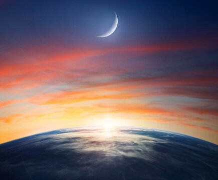  View of the Earth and crescent moon. Symbolic night scene often associated with Islam, Muslim culture, religion, and spiritual meaning. Elements of this image furnished by NASA.