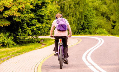 Fototapeta premium Cyclist ride on the bike path in the city Park 