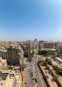 Aerial view of I.I. Chundrigar Road with dense urban architecture and busy traffic in Karachi, Sindh, Pakistan.