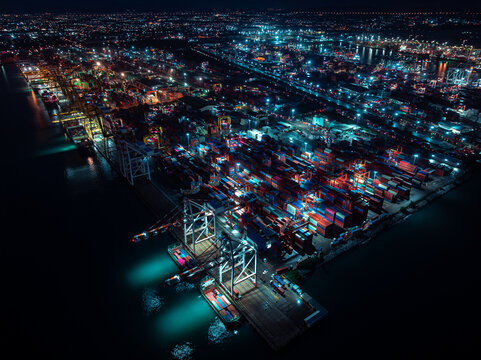 Nighttime Industrial Container Terminal Operations Glowing In Laem Chabang Chon Buri Thailand