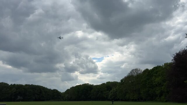 Aircraft flying over Amsterdam Forest park near Schiphol Airport, Netherlands Aircraft flying over Amsterdam Forest