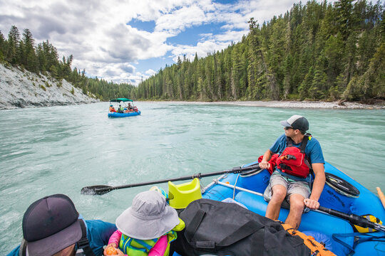 Family on a scenic river rafting trip