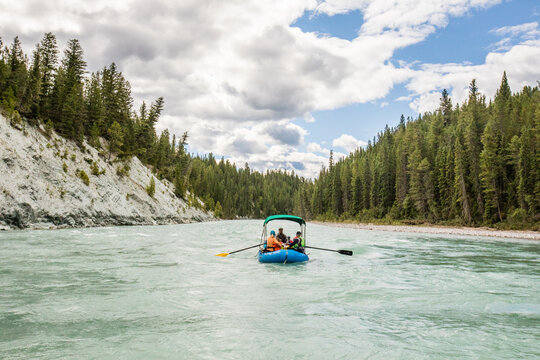 Group rafting down a scenic wilderness river