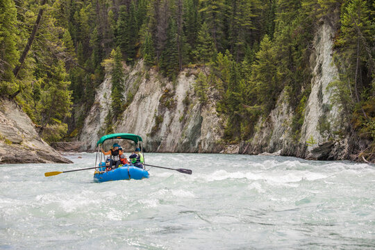 People on a guided whitewater rafting tour