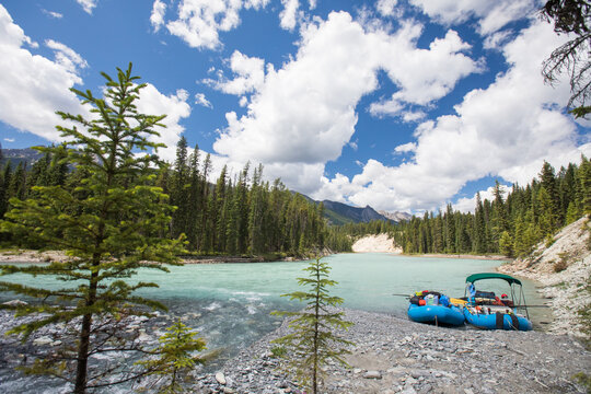 Two rafts moored on a beautiful turquoise mountain river