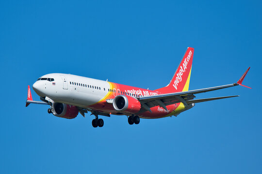 VietJet Air Boeing 737 MAX 8 (HS-VZC) passenger plane approaching Narita International Airport for landing under clear blue sky