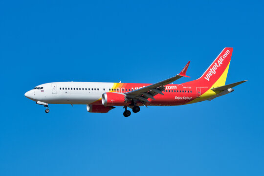 VietJet Air Boeing 737 MAX 8 (HS-VZC) passenger plane approaching Narita International Airport for landing under clear blue sky