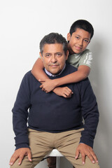 Obraz premium Latino single dad and his 12-year-old Latino son show their love to celebrate Father's Day