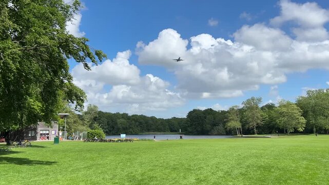Aircraft flying over Amsterdam Forest park near Schiphol Airport, Netherlands Aircraft flying over Amsterdam Forest