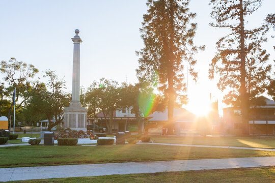 Cenotaph at sunrise with ANZAC day wreaths laid in memorial