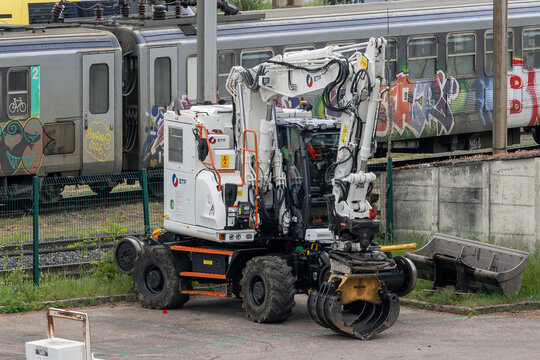 Nancy, France - May 16th 2026 : View on a white road-rail wheeled excavator D2R ZX170-7 PRR on a construction site for the renovation of a railway line.	