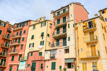 Fototapeta premium Colorful buildings lining a hillside in coastal italian village
